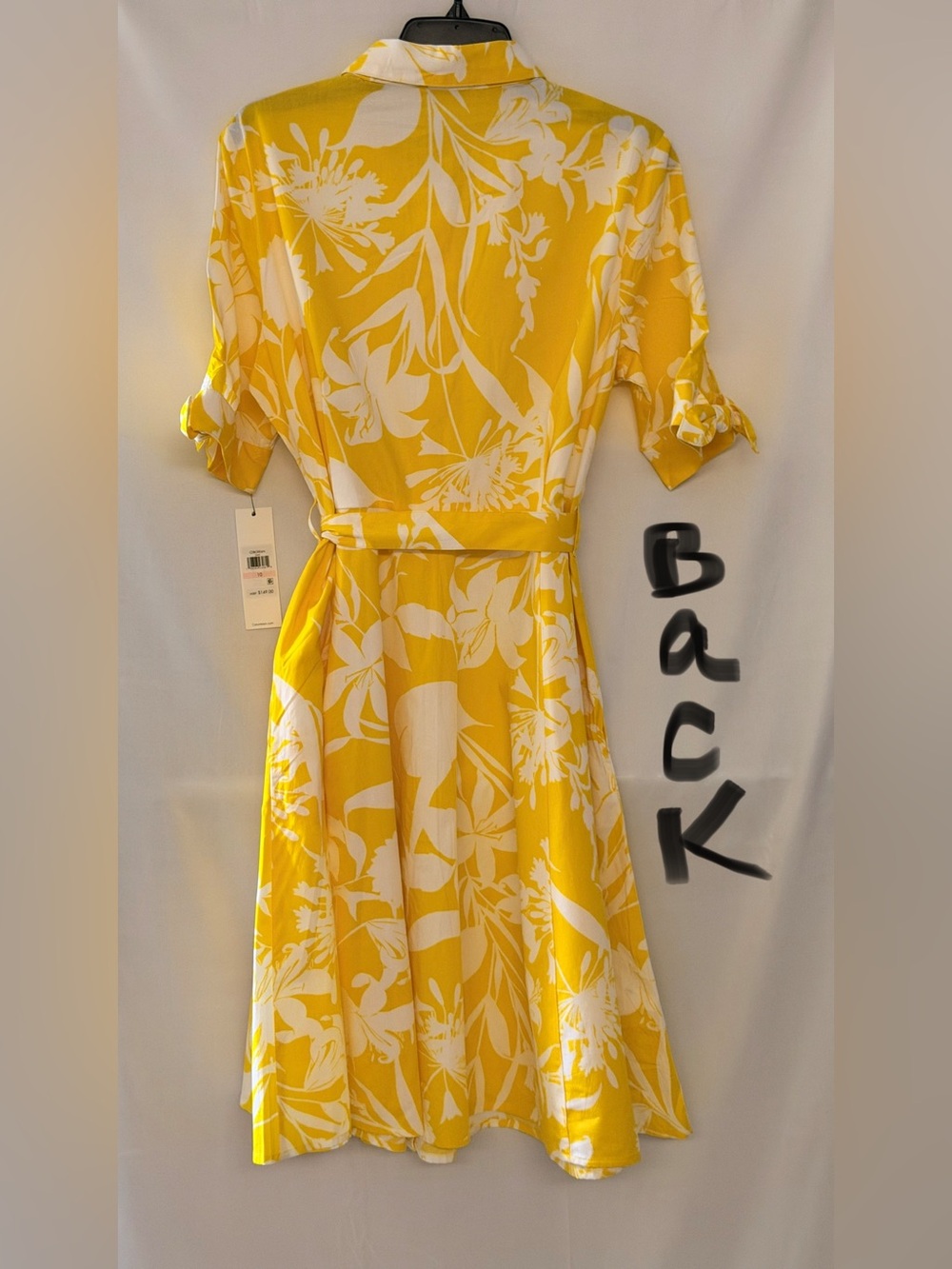 Calvin Klein Yellow & White Floral Midi Shirt Dress 
It has pockets on both side - Picture 2 of 3